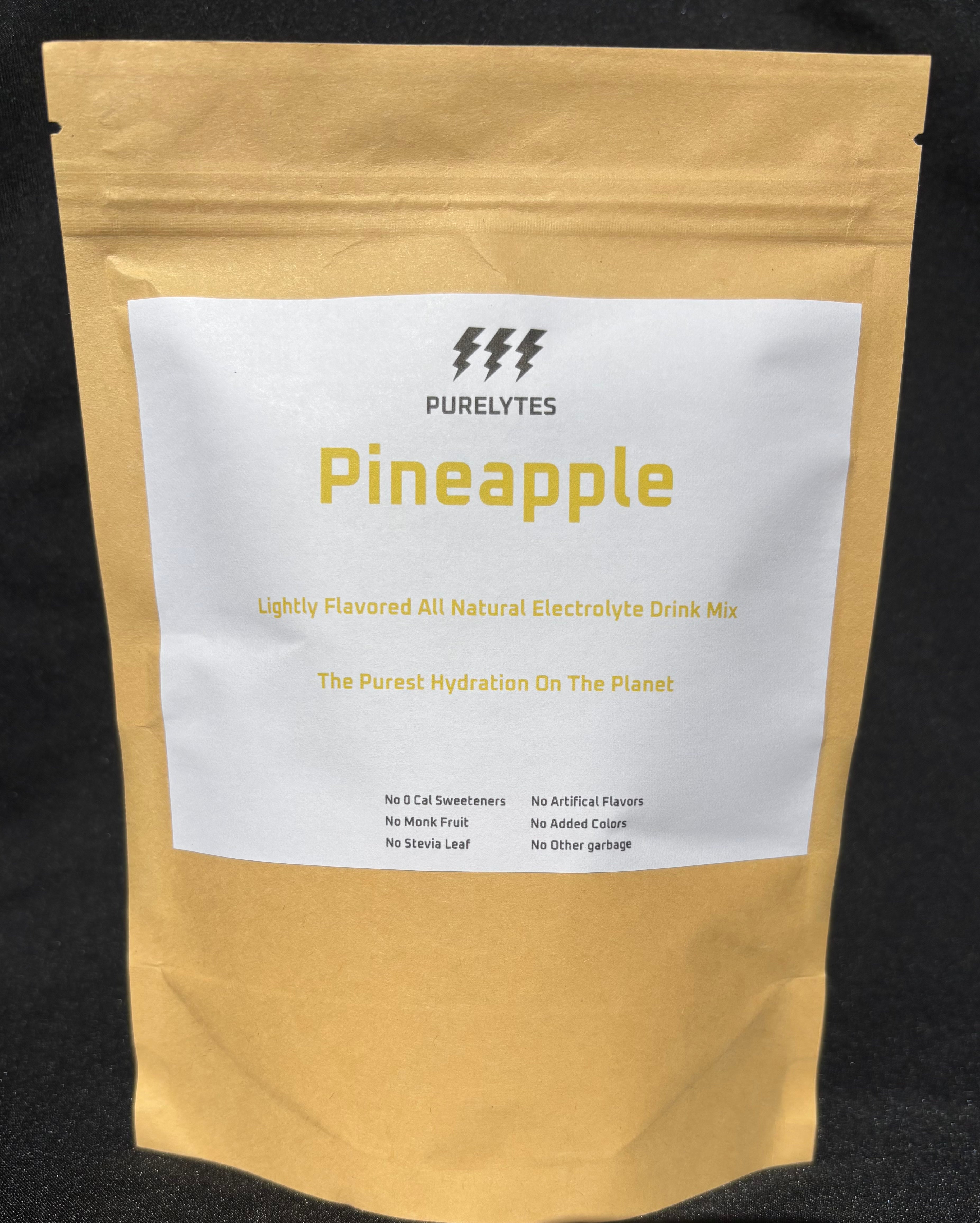 Pineapple-flavored electrolyte drink mix package with 'Purelytes' branding on a black background
